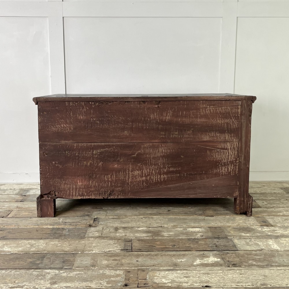 A dark red painted Georgian pine mule chest featuring a hinged top lid above two lower drawers with turned wooden knobs. View XV