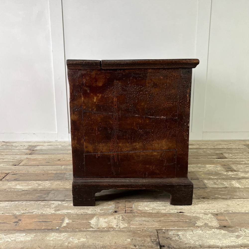A dark red painted Georgian pine mule chest featuring a hinged top lid above two lower drawers with turned wooden knobs. View XVIII
