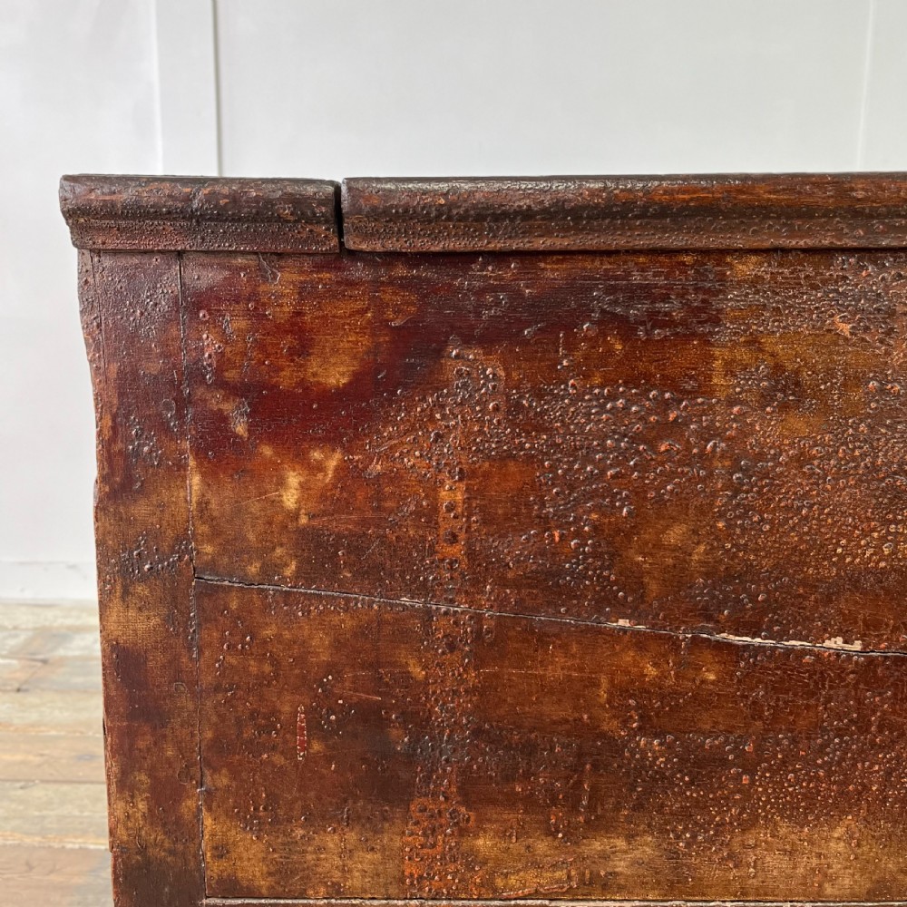 A dark red painted Georgian pine mule chest featuring a hinged top lid above two lower drawers with turned wooden knobs. View XIX