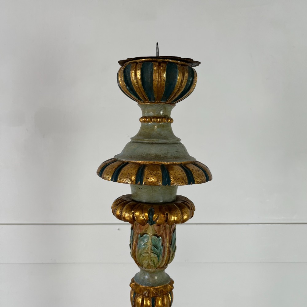 A tall 19th-century Italian carved giltwood and polychrome painted floor candlestick featuring a spiral column shaft resting on a tripod scroll base. View II