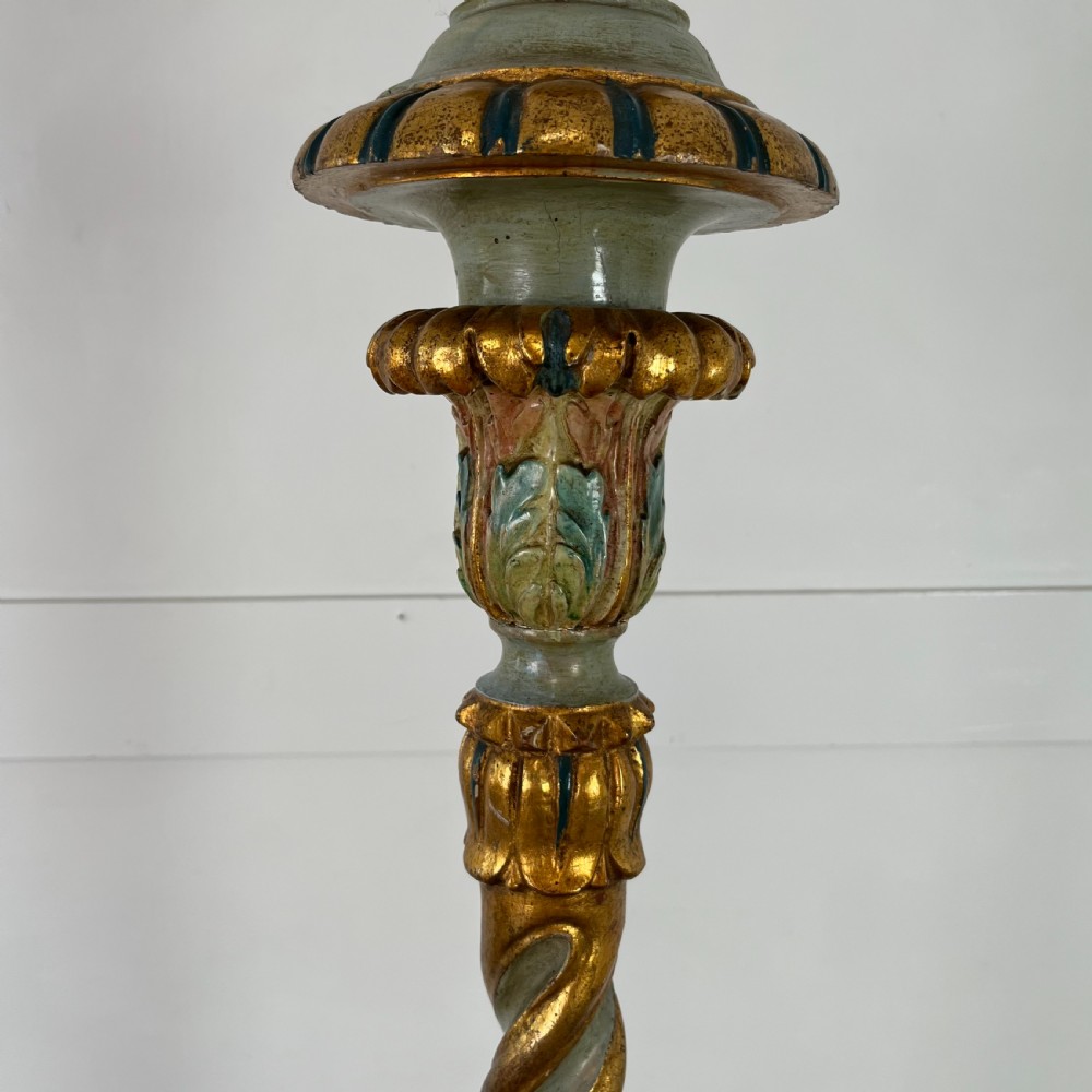 A tall 19th-century Italian carved giltwood and polychrome painted floor candlestick featuring a spiral column shaft resting on a tripod scroll base. View III