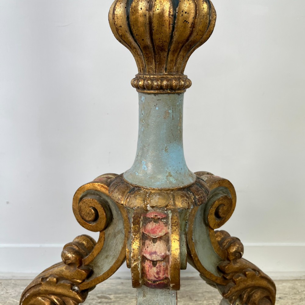 A tall 19th-century Italian carved giltwood and polychrome painted floor candlestick featuring a spiral column shaft resting on a tripod scroll base. View VII