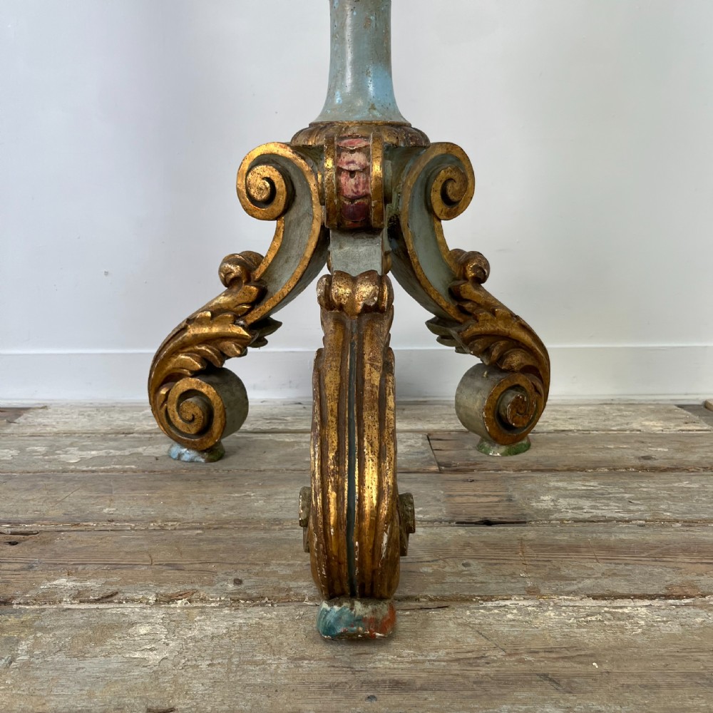 A tall 19th-century Italian carved giltwood and polychrome painted floor candlestick featuring a spiral column shaft resting on a tripod scroll base. View VIII