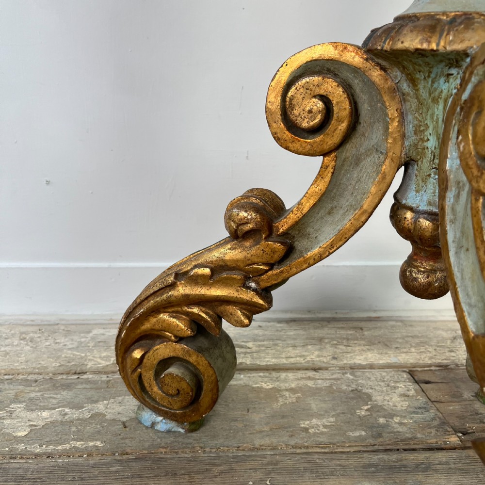 A tall 19th-century Italian carved giltwood and polychrome painted floor candlestick featuring a spiral column shaft resting on a tripod scroll base. View IX
