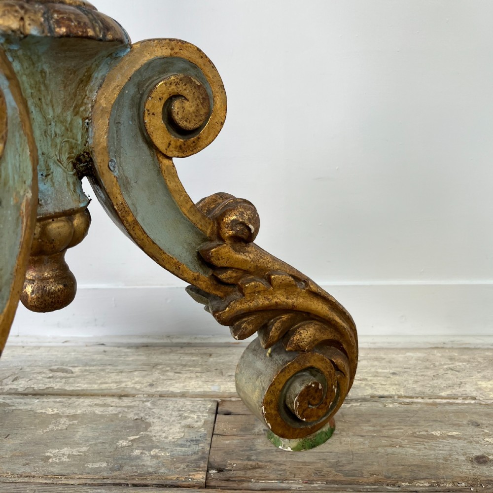 A tall 19th-century Italian carved giltwood and polychrome painted floor candlestick featuring a spiral column shaft resting on a tripod scroll base. View XI