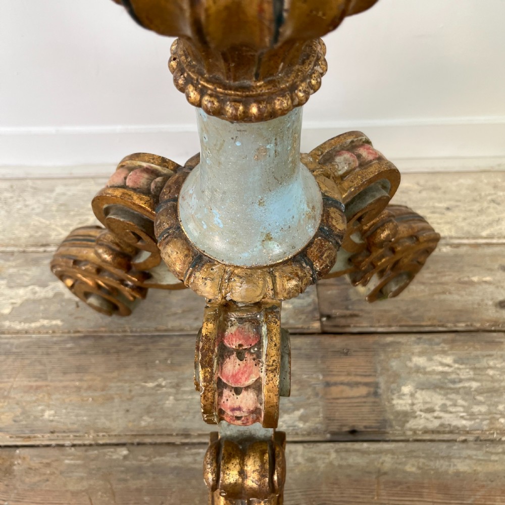 A tall 19th-century Italian carved giltwood and polychrome painted floor candlestick featuring a spiral column shaft resting on a tripod scroll base. View XII