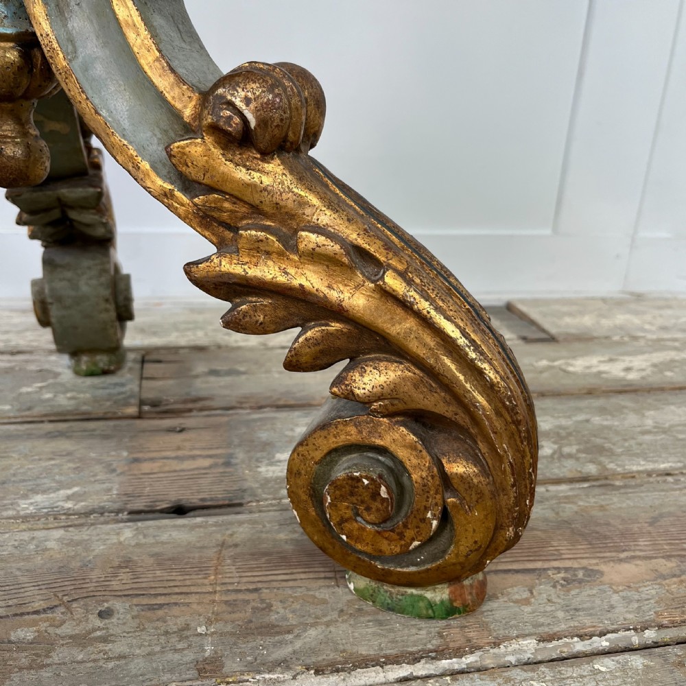 A tall 19th-century Italian carved giltwood and polychrome painted floor candlestick featuring a spiral column shaft resting on a tripod scroll base. View XIV