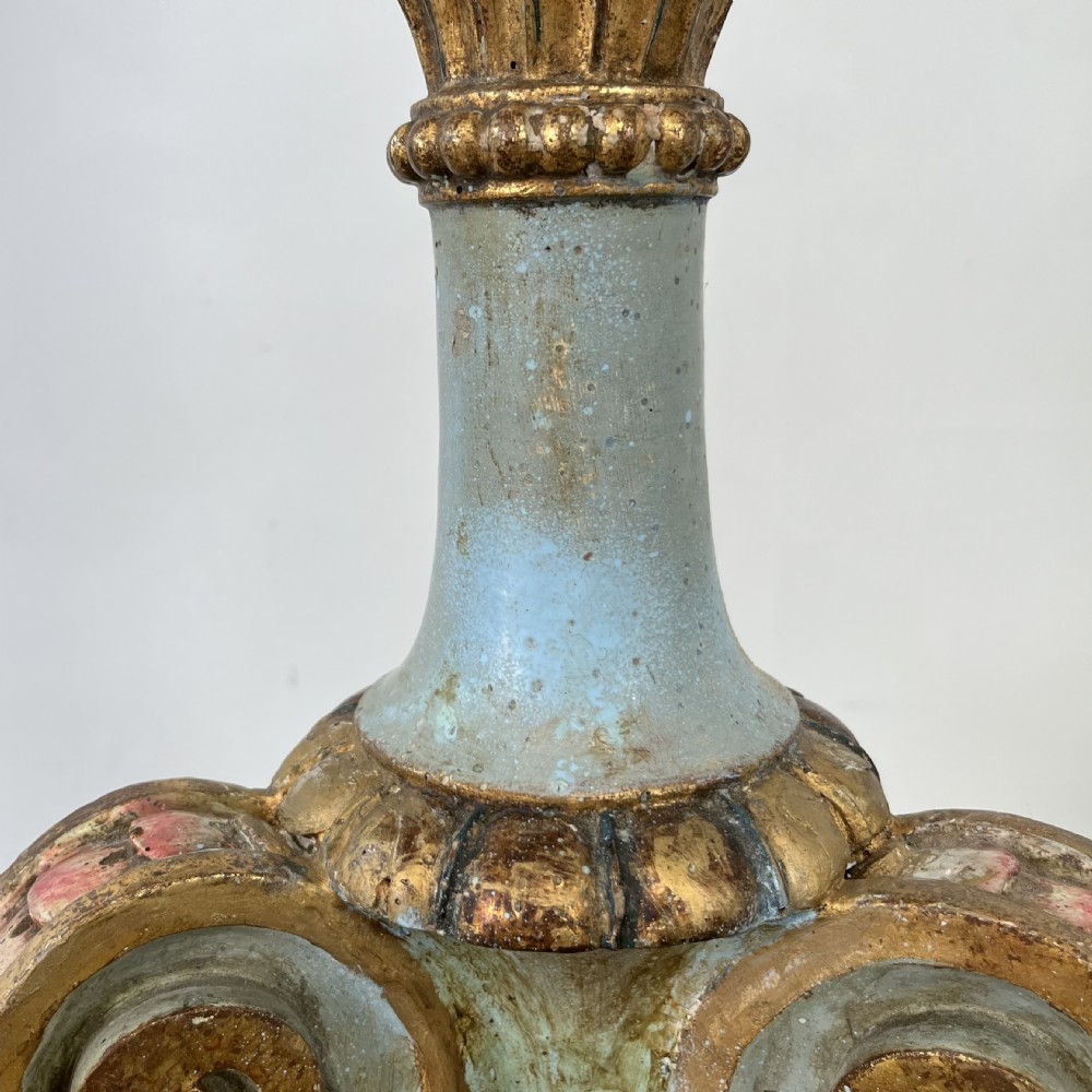 A tall 19th-century Italian carved giltwood and polychrome painted floor candlestick featuring a spiral column shaft resting on a tripod scroll base. View XV