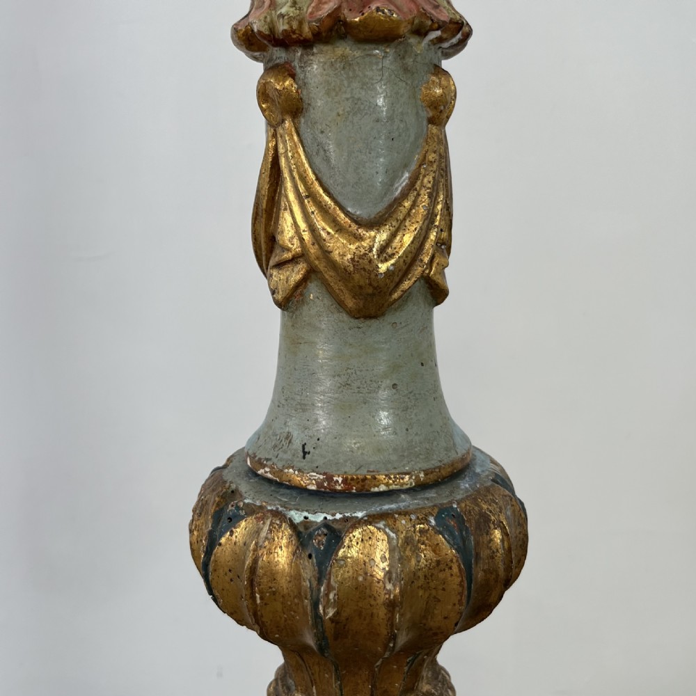 A tall 19th-century Italian carved giltwood and polychrome painted floor candlestick featuring a spiral column shaft resting on a tripod scroll base. View XVI