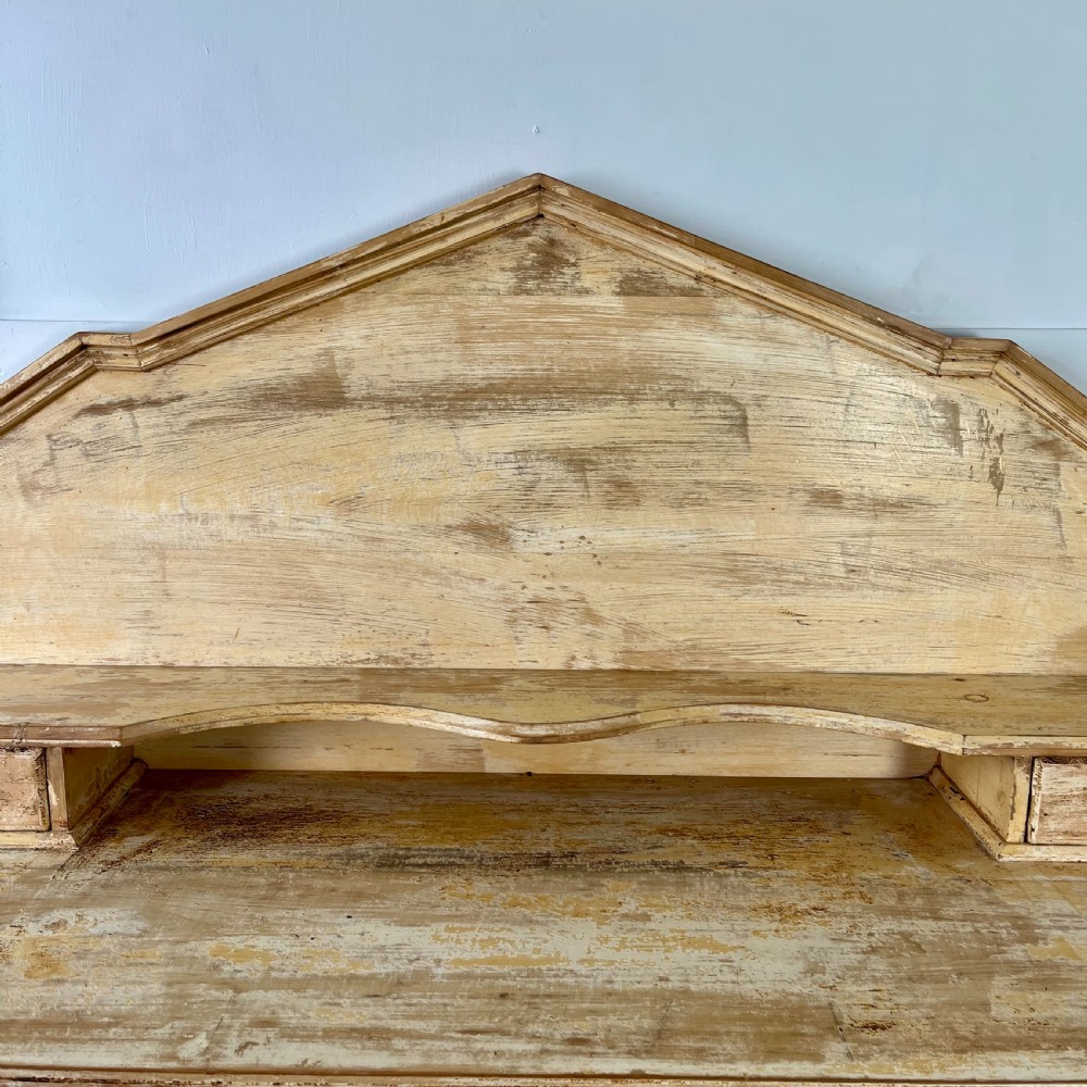 Victorian painted pine dresser with a shaped architectural backboard, multiple drawers, central cupboard, and bun feet in a distressed finish. View VIII