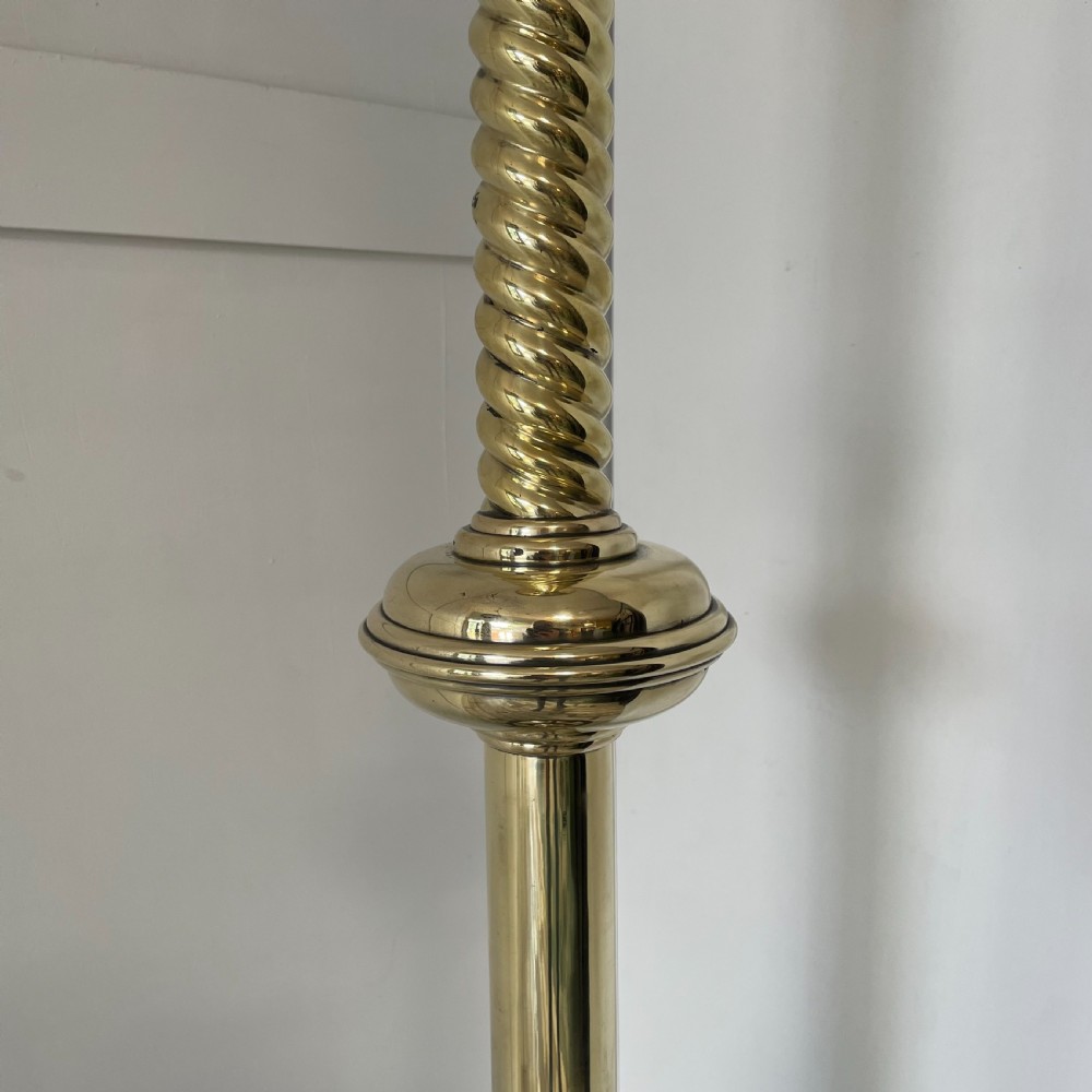 A tall 19th-century Gothic Revival floor-standing church candlestick with a spiral-twist brass column and a dark metal flared base. View III
