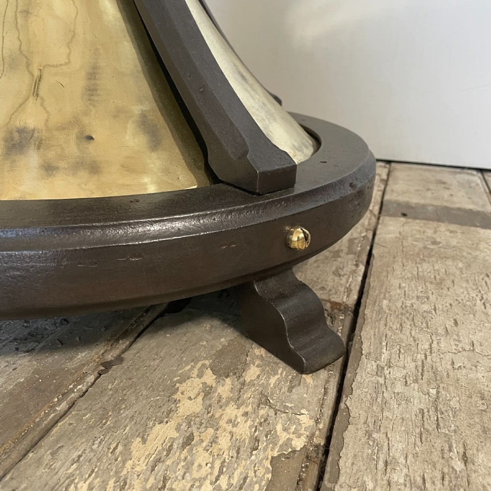 A tall 19th-century Gothic Revival floor-standing church candlestick with a spiral-twist brass column and a dark metal flared base. View VIII