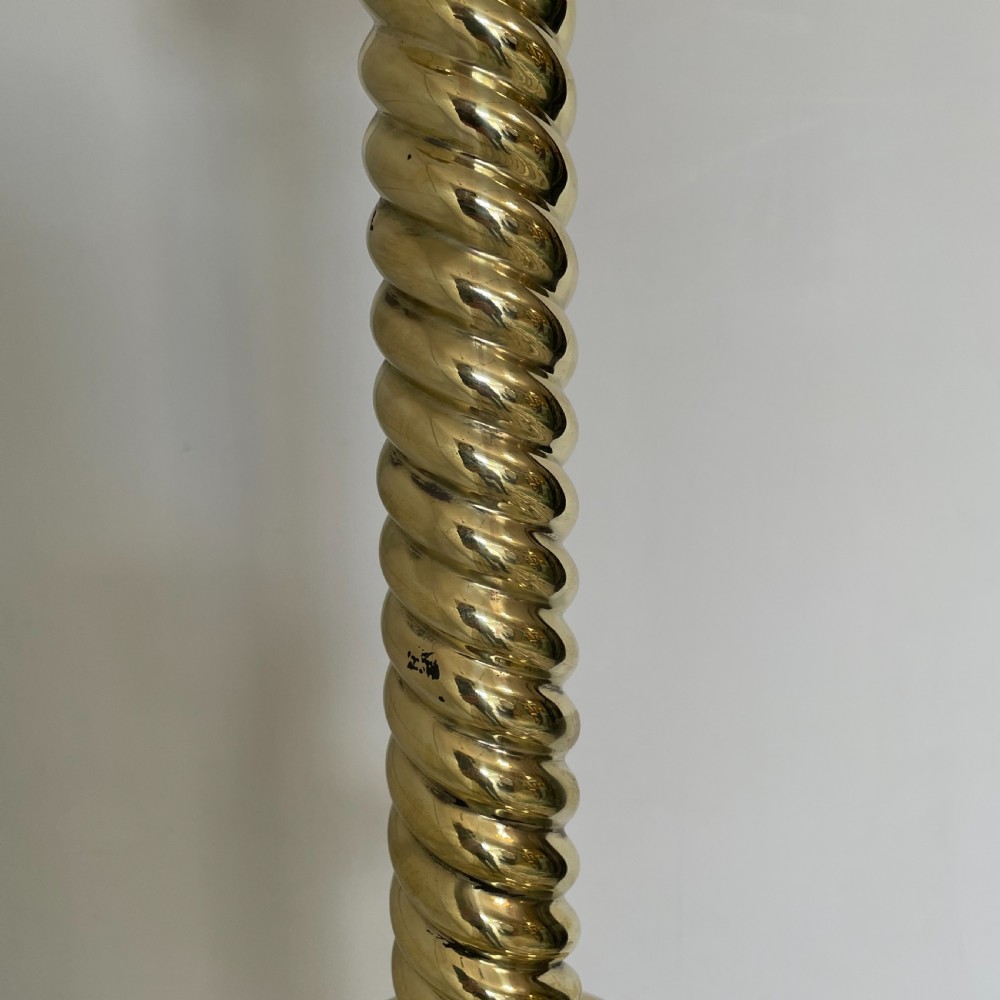 A tall 19th-century Gothic Revival floor-standing church candlestick with a spiral-twist brass column and a dark metal flared base. View IX