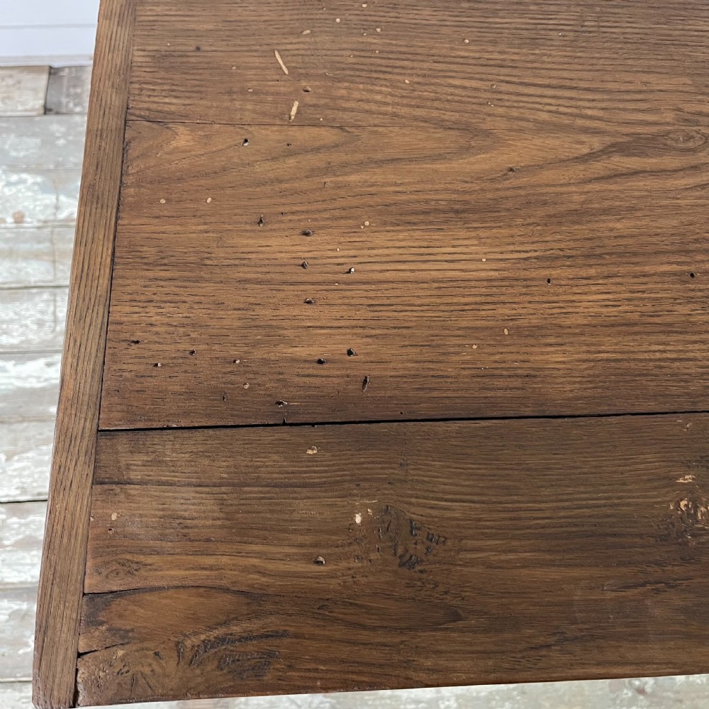 A dark stained Victorian pine monks bench featuring a tall planked backrest, flat wooden armrests, and a vertical panelled base. View XIV