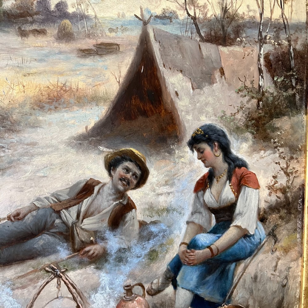 A pair of matching 19th-century oil paintings on board depicting rural peasant scenes in ornate carved gold gilt frames. View III