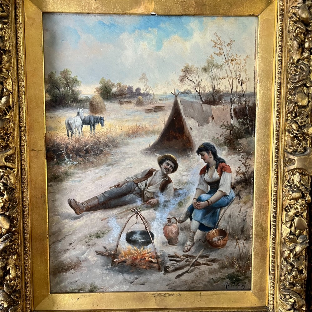 A pair of matching 19th-century oil paintings on board depicting rural peasant scenes in ornate carved gold gilt frames. View VI