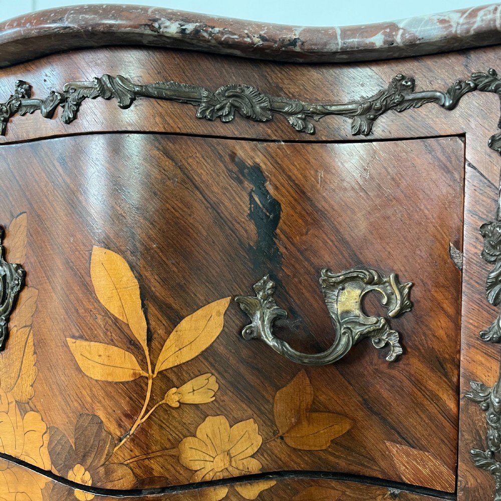 A nineteenth-century French rosewood commode featuring intricate floral marquetry, gilt-bronze mounts, three drawers, and a shaped marble top. View VIII