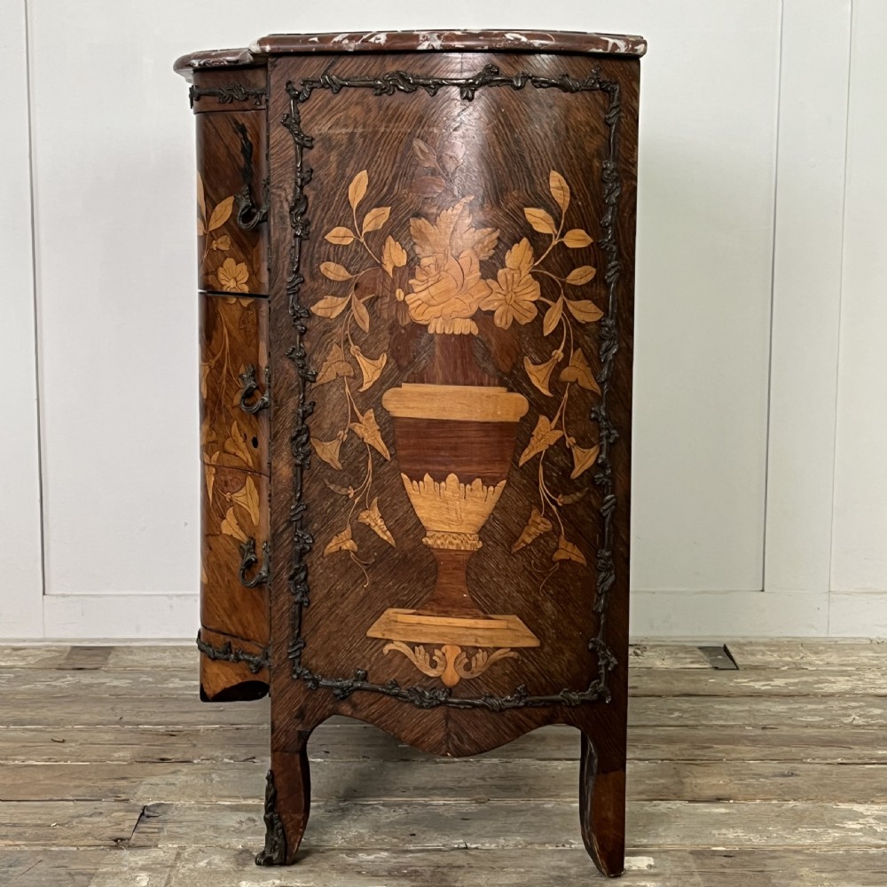 A nineteenth-century French rosewood commode featuring intricate floral marquetry, gilt-bronze mounts, three drawers, and a shaped marble top. View XII