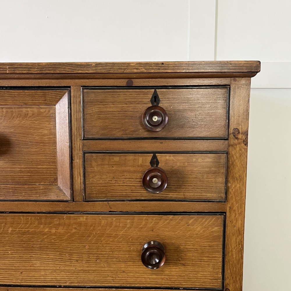 A large Victorian scumble painted pine chest of drawers featuring five graduated drawers and turned wooden knobs. View IV