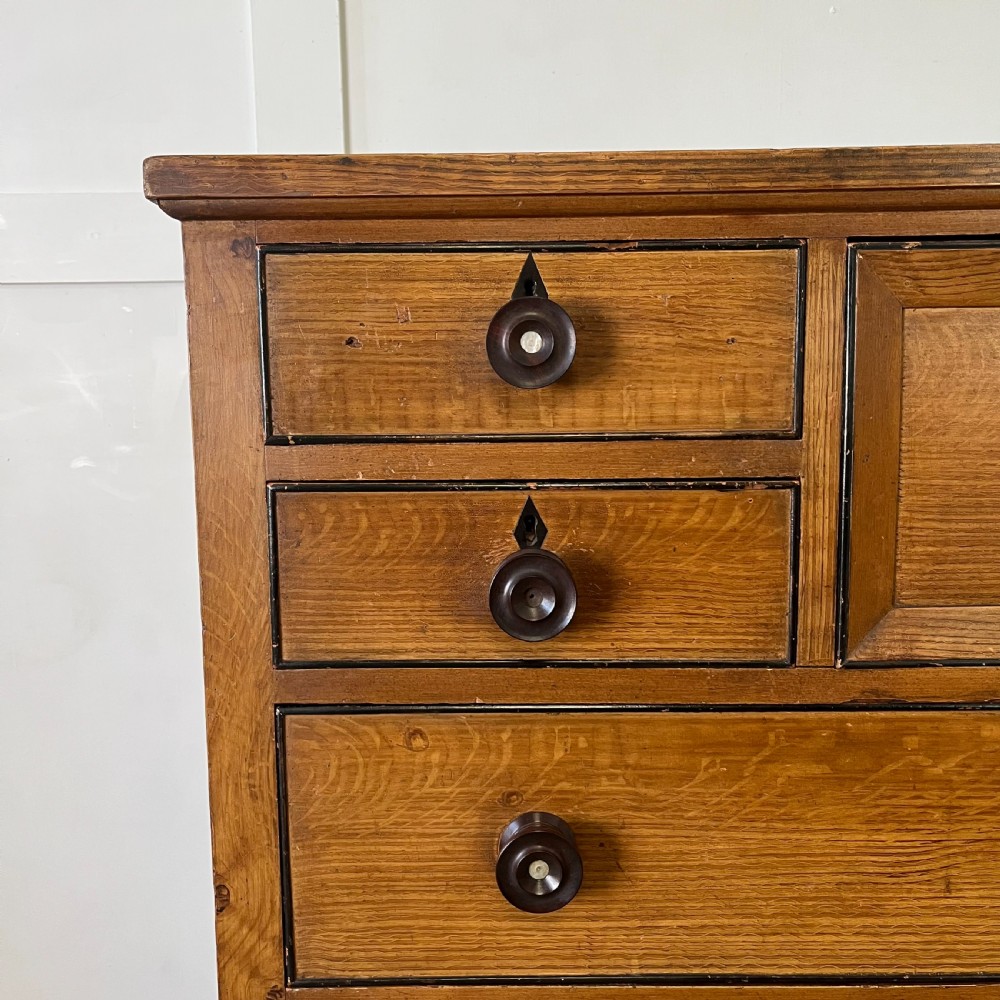 A large Victorian scumble painted pine chest of drawers featuring five graduated drawers and turned wooden knobs. View V