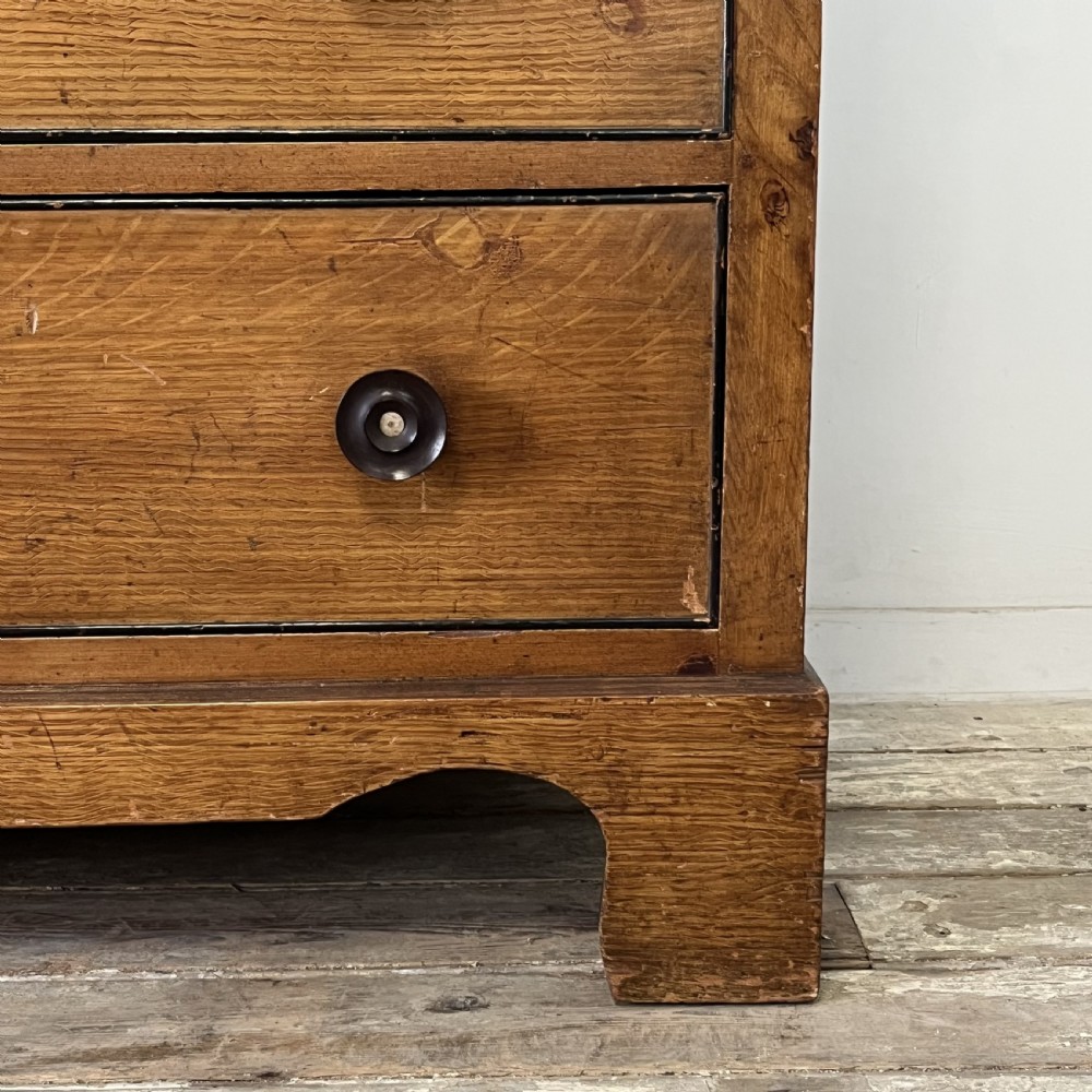 A large Victorian scumble painted pine chest of drawers featuring five graduated drawers and turned wooden knobs. View VIII
