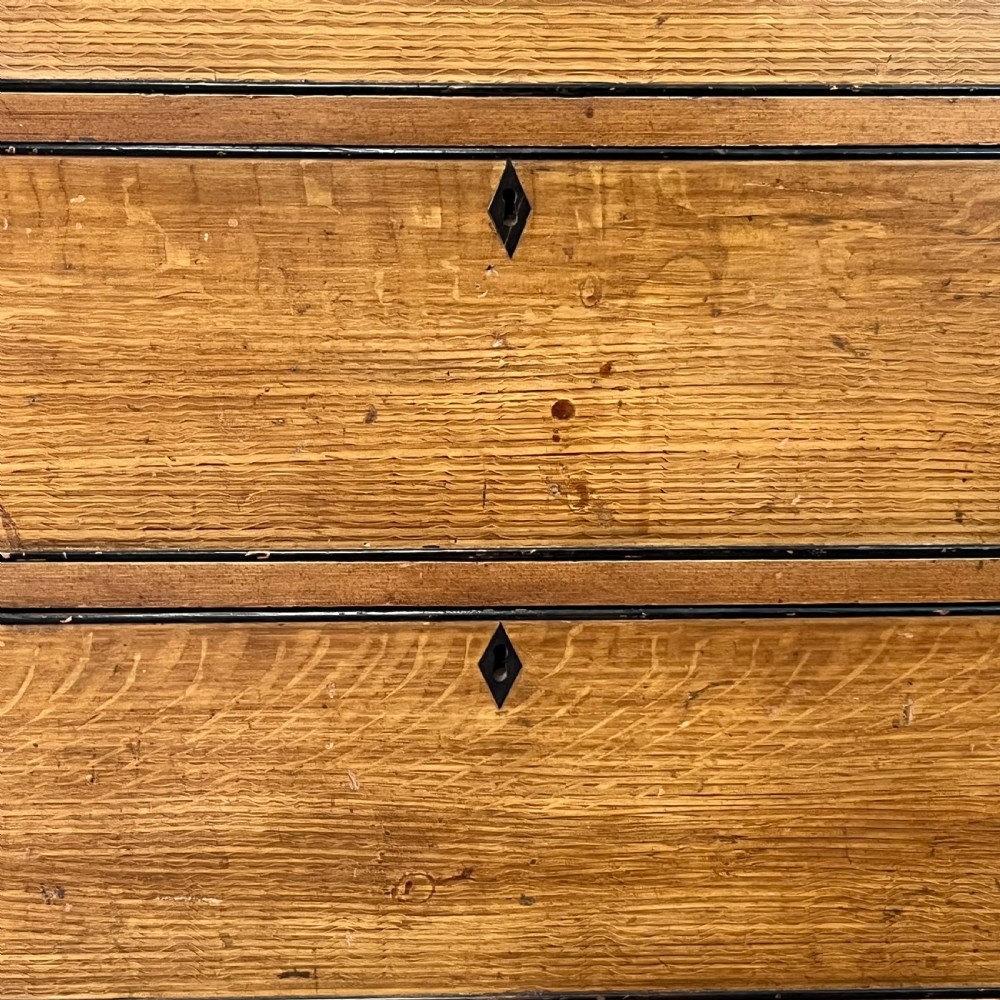 A large Victorian scumble painted pine chest of drawers featuring five graduated drawers and turned wooden knobs. View X