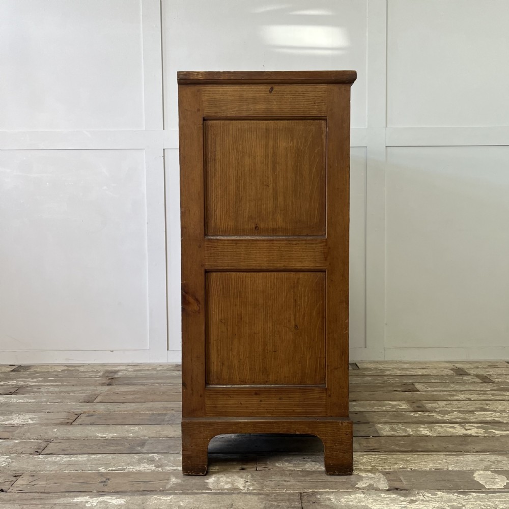 A large Victorian scumble painted pine chest of drawers featuring five graduated drawers and turned wooden knobs. View XX