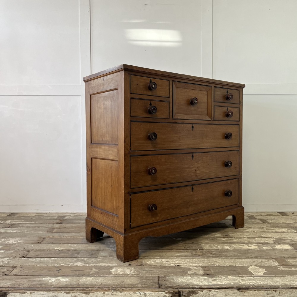 A large Victorian scumble painted pine chest of drawers featuring five graduated drawers and turned wooden knobs. View XXI