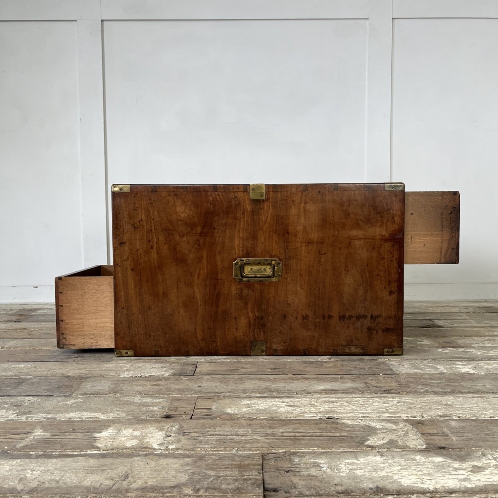 A nineteenth-century rectangular wooden desktop campaign chest featuring two drawers, flush brass drop handles, and brass corner straps. View XI