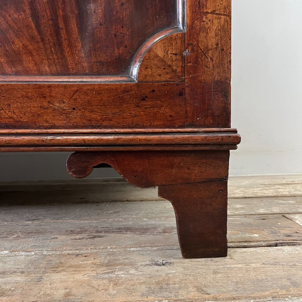A dark mahogany George III secretaire bookcase featuring upper astragal glazed doors, a fold-out secretaire desk section with green leather insert, and lower cupboard doors on bracket feet. View XIII