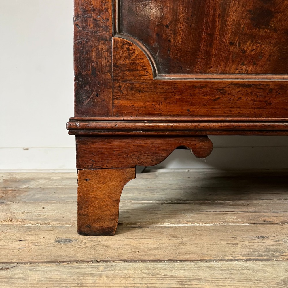 A dark mahogany George III secretaire bookcase featuring upper astragal glazed doors, a fold-out secretaire desk section with green leather insert, and lower cupboard doors on bracket feet. View XIV