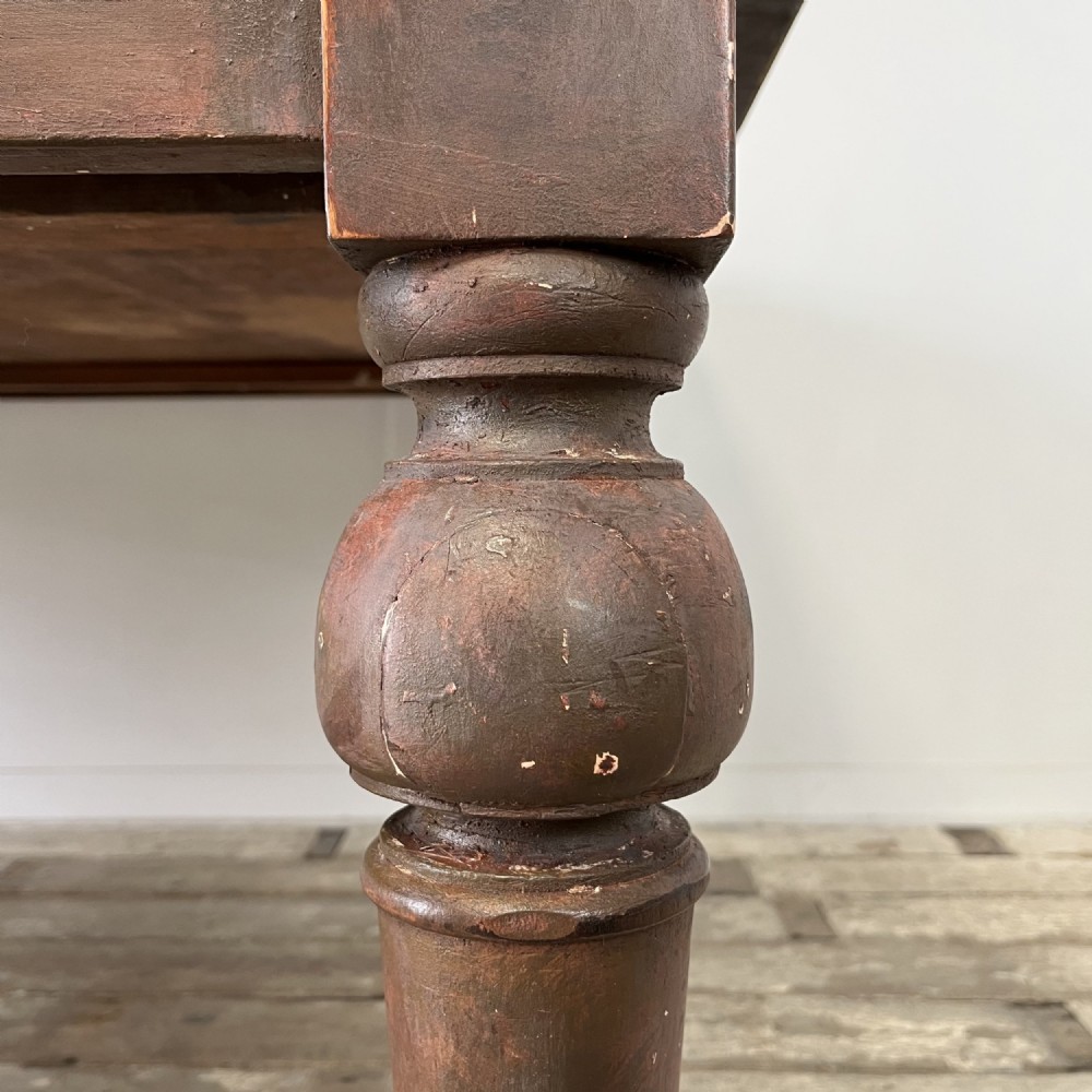 A large Victorian pine farmhouse table featuring a light natural wood plank top supported by dark brown turned wooden legs. View XI