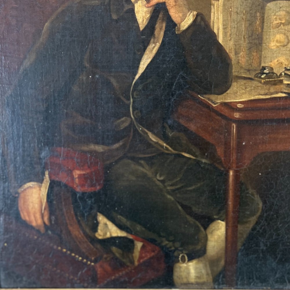A nineteenth-century oil portrait depicting a seated gentleman resting his chin on his hand, presented in an elaborate gilded swept frame. View III