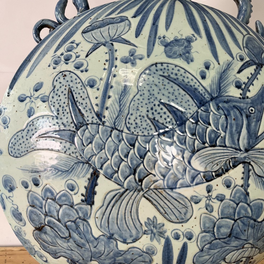 An extra large blue and white Chinese style porcelain moon flask decorated with a carp among lotus blossoms and styled with twin dragon handles. View II