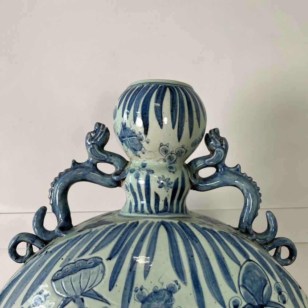 An extra large blue and white Chinese style porcelain moon flask decorated with a carp among lotus blossoms and styled with twin dragon handles. View IV