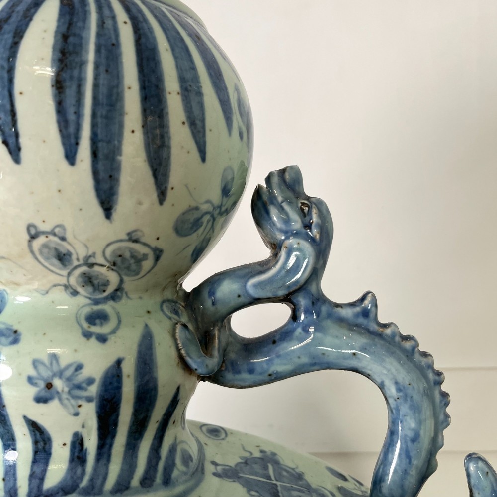 An extra large blue and white Chinese style porcelain moon flask decorated with a carp among lotus blossoms and styled with twin dragon handles. View V