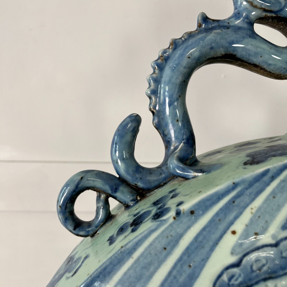 An extra large blue and white Chinese style porcelain moon flask decorated with a carp among lotus blossoms and styled with twin dragon handles. View VI
