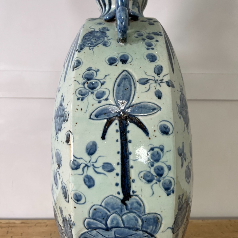 An extra large blue and white Chinese style porcelain moon flask decorated with a carp among lotus blossoms and styled with twin dragon handles. View IX