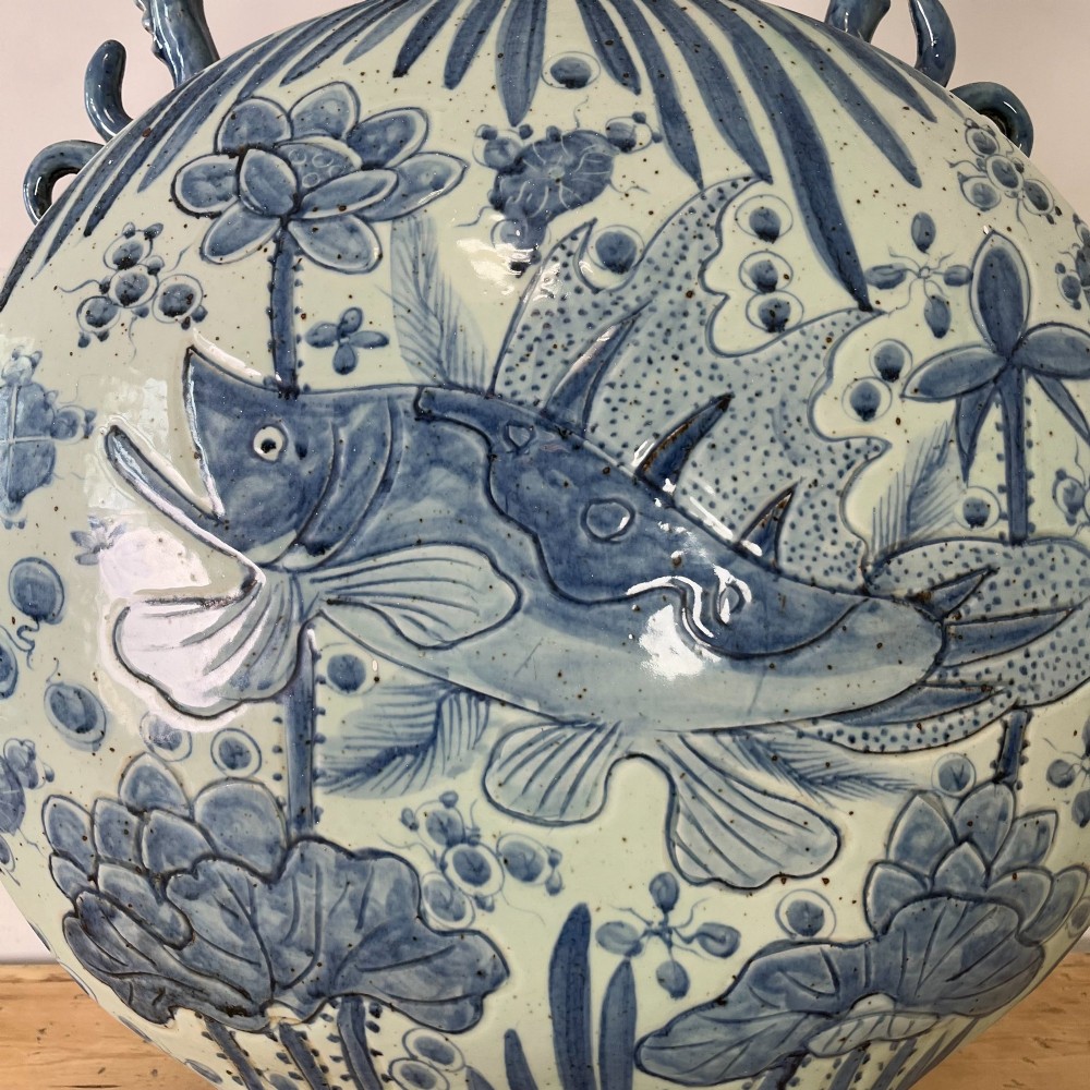 An extra large blue and white Chinese style porcelain moon flask decorated with a carp among lotus blossoms and styled with twin dragon handles. View XII