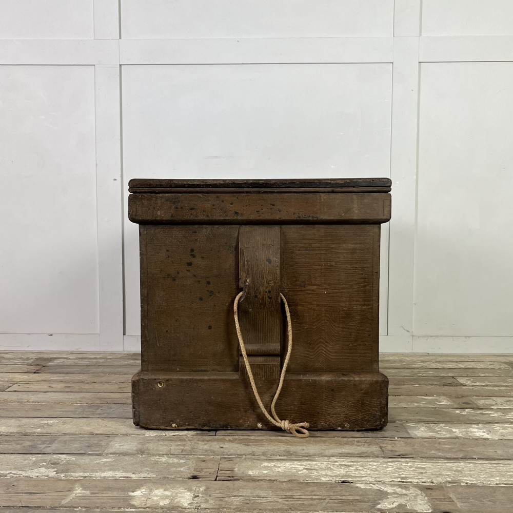 An early 20th-century pine carpenters chest featuring an upper hinged lid and multiple shallow lower drawers with small round knobs. View X
