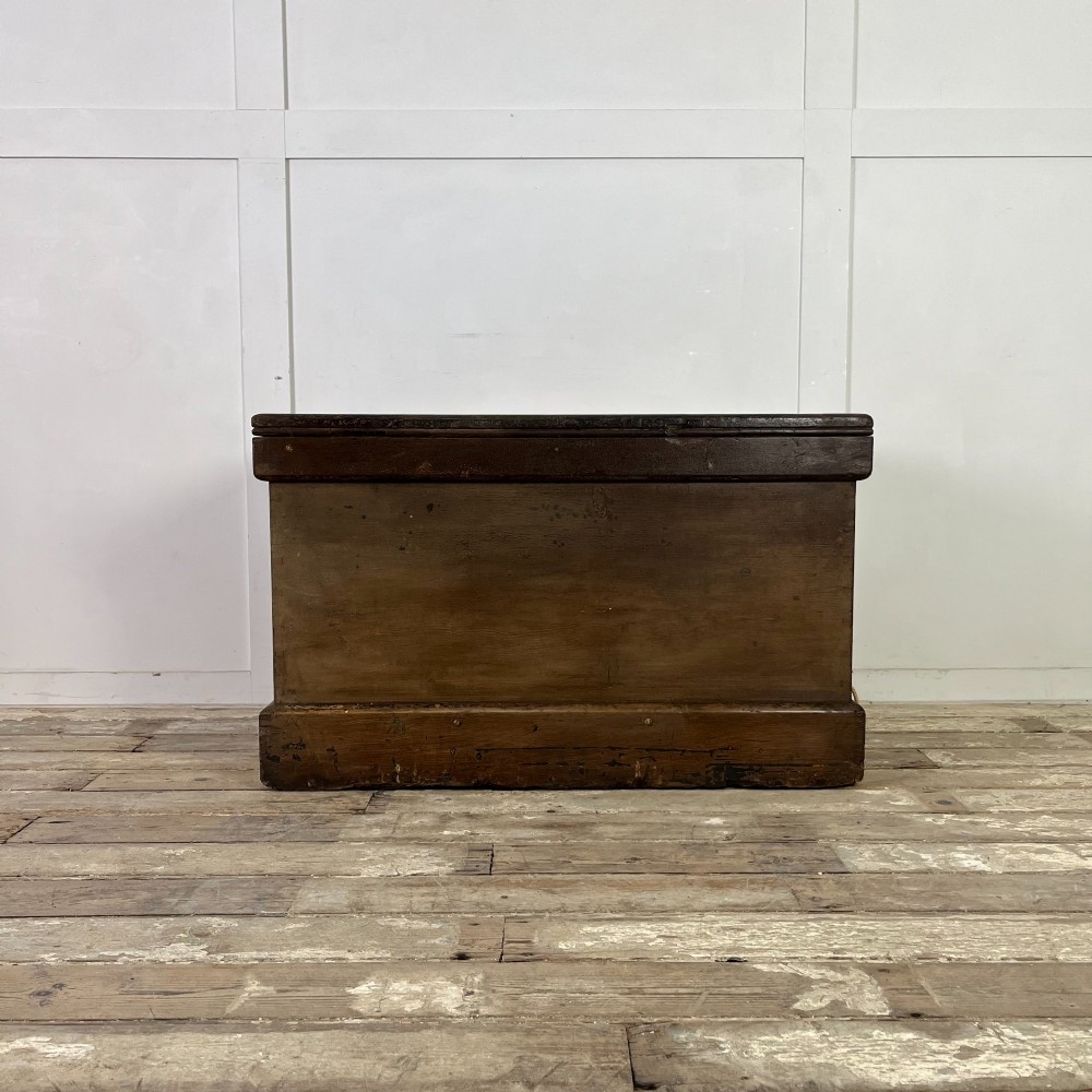An early 20th-century pine carpenters chest featuring an upper hinged lid and multiple shallow lower drawers with small round knobs. View XI