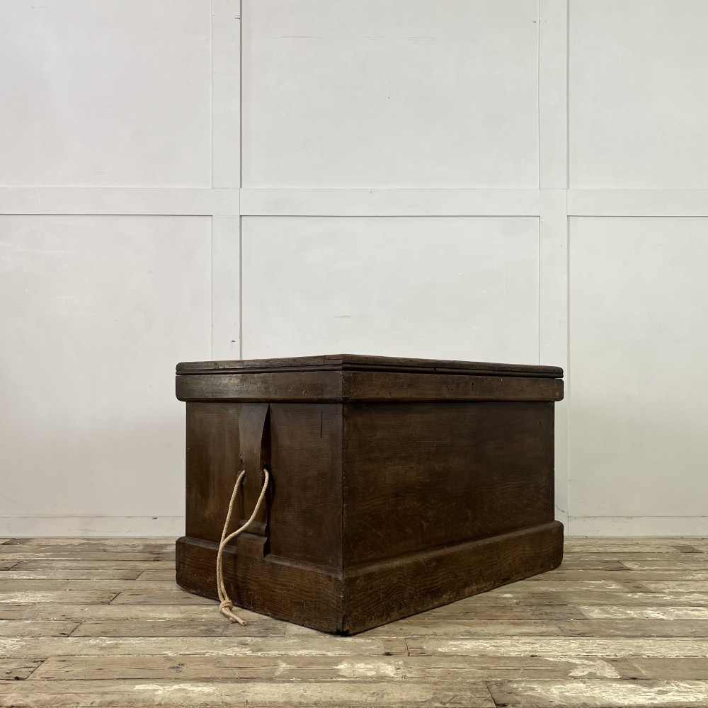 An early 20th-century pine carpenters chest featuring an upper hinged lid and multiple shallow lower drawers with small round knobs. View XIII