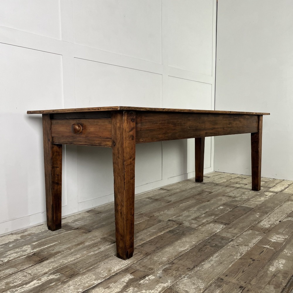 A long 19th-century pine farmhouse dining table with tapered square legs and a warm brown waxed finish. View VIII