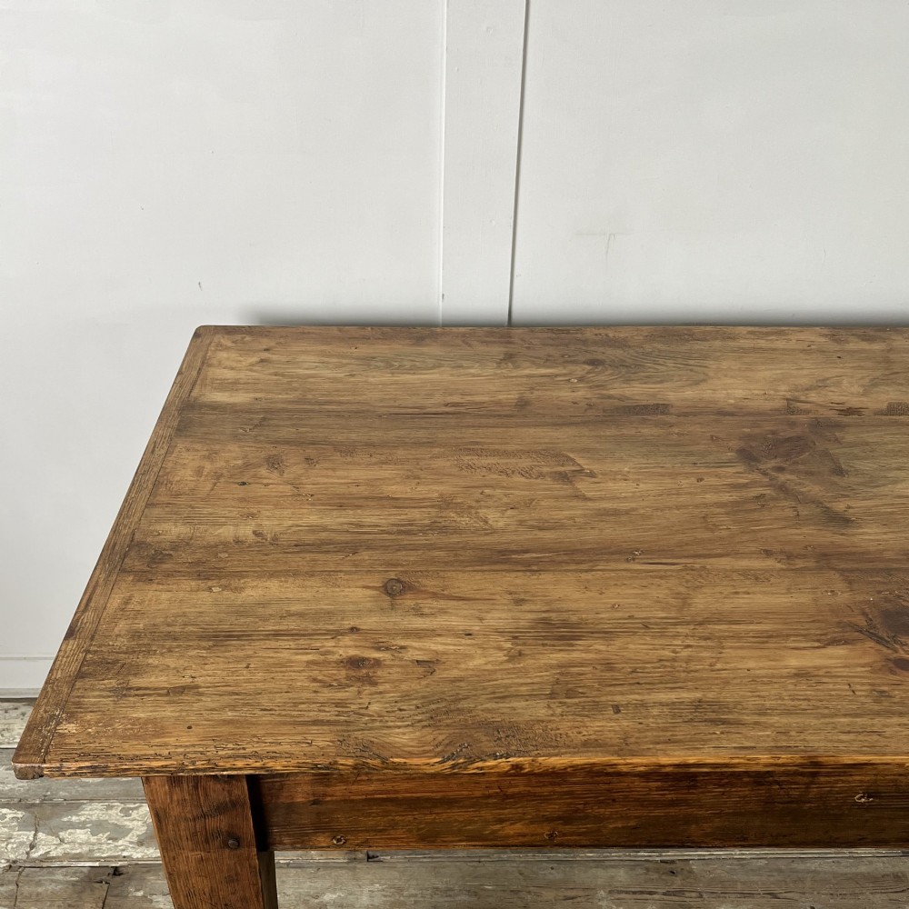 A long 19th-century pine farmhouse dining table with tapered square legs and a warm brown waxed finish. View X
