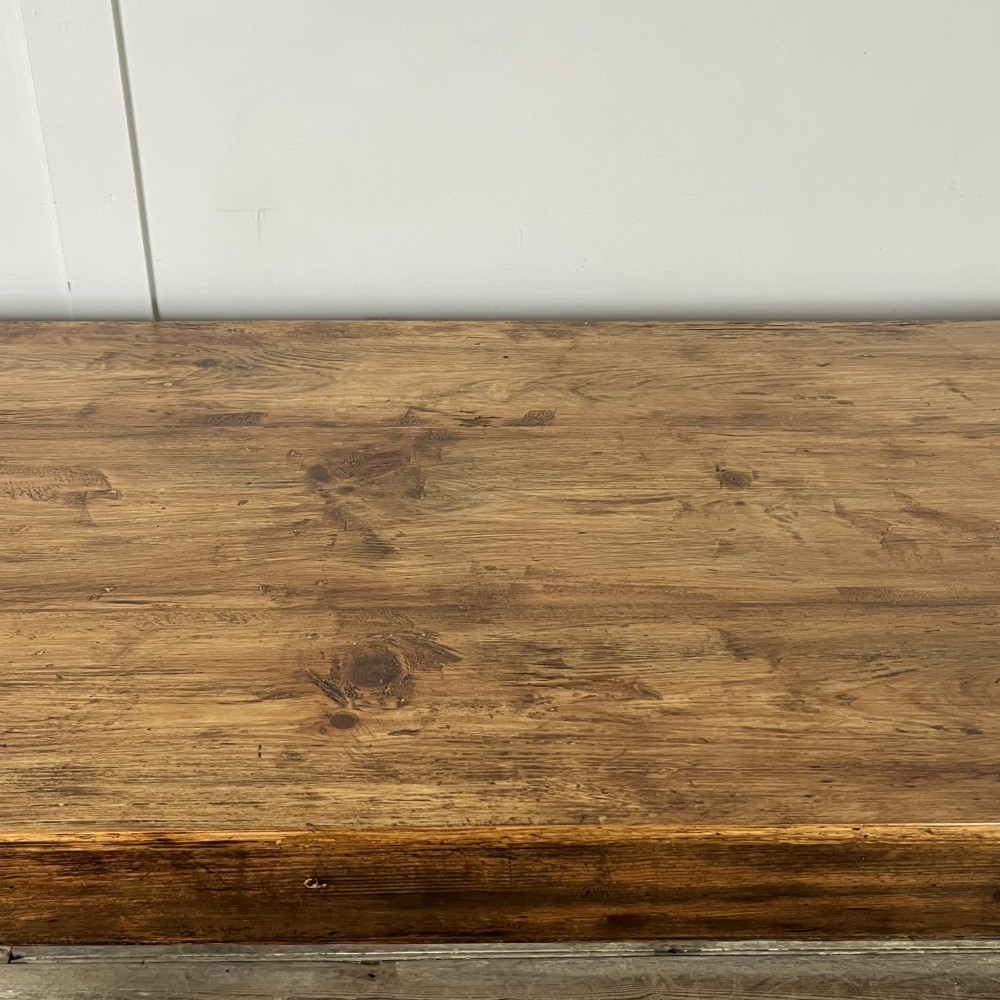 A long 19th-century pine farmhouse dining table with tapered square legs and a warm brown waxed finish. View XI