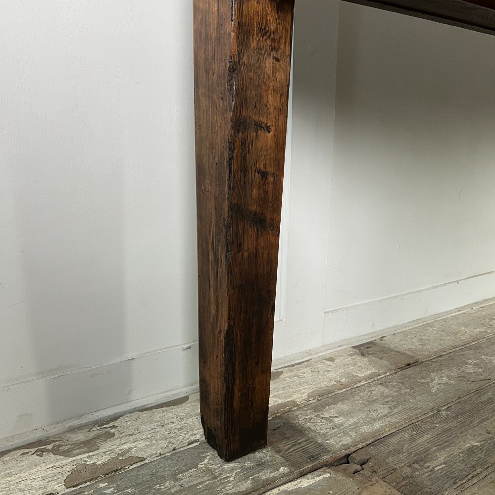 A long 19th-century pine farmhouse dining table with tapered square legs and a warm brown waxed finish. View XIV