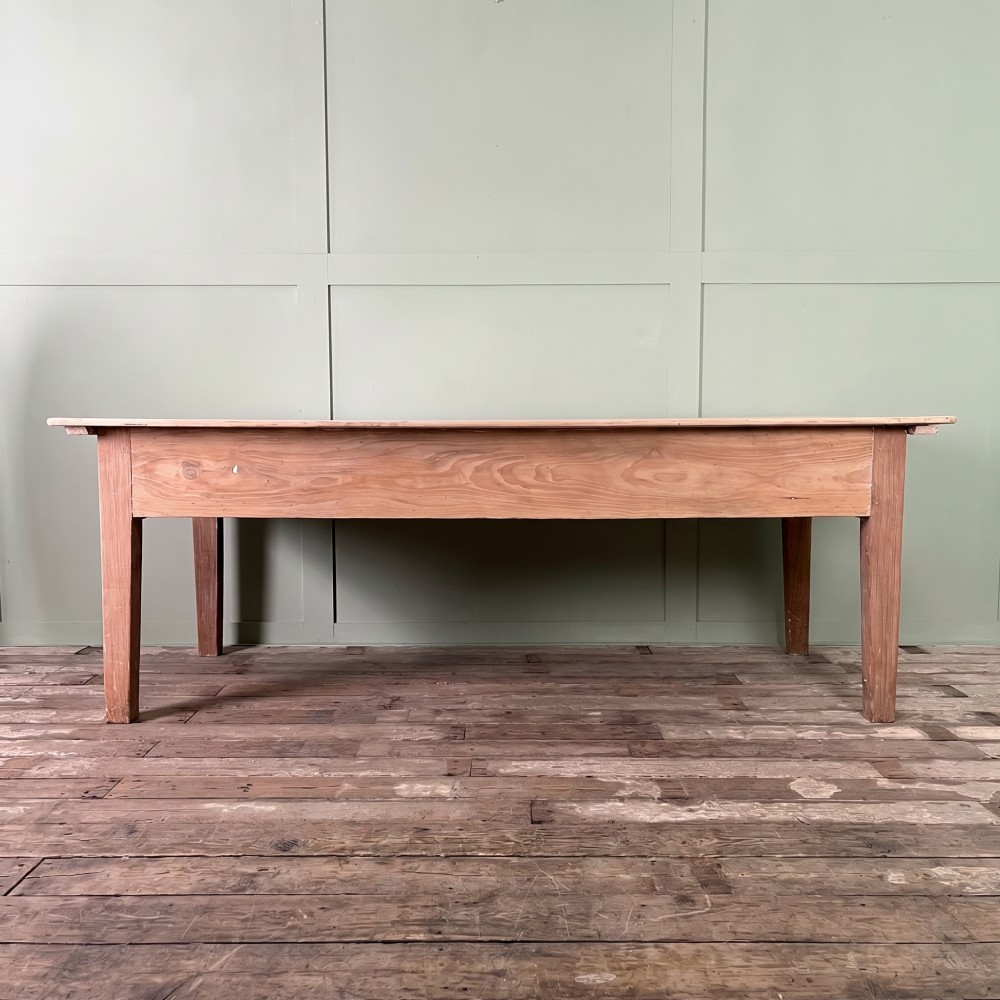 An early nineteenth-century timber prep table featuring three drawers with round wooden knobs set above four tapered legs. View IV