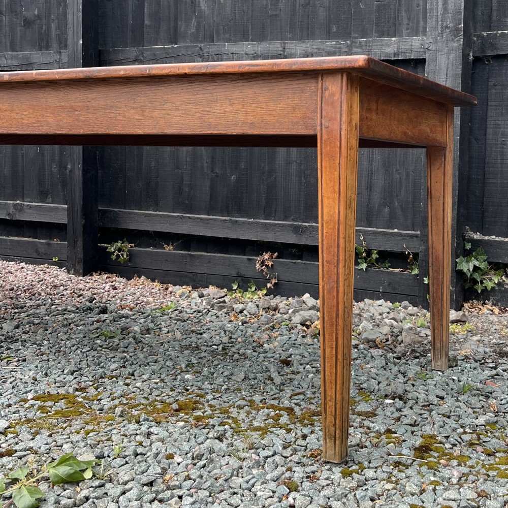 A 3.8-metre long 19th-century French cherrywood farmhouse dining table supported by six tapered square legs. View IV