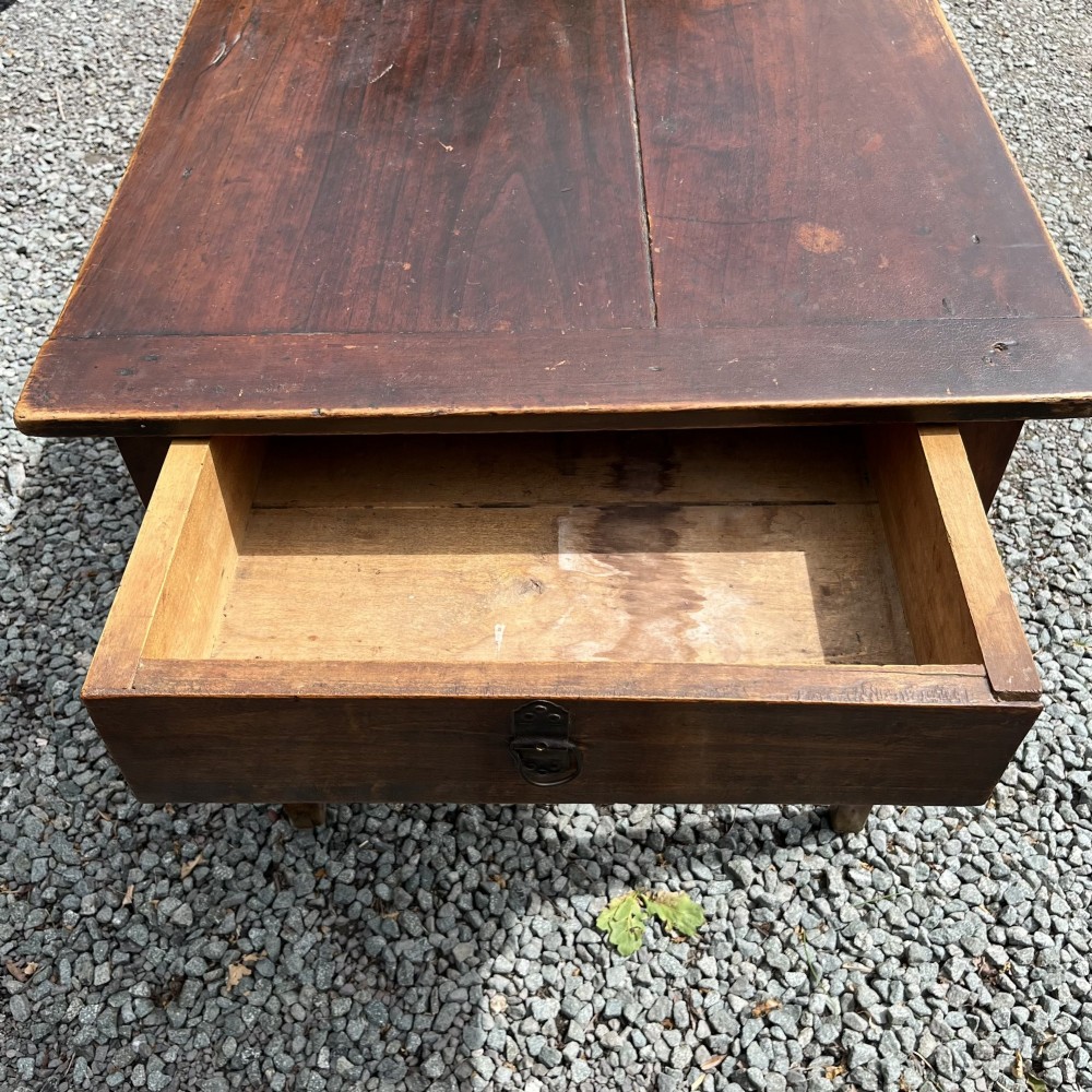 An exceptionally long 19th-century French cherrywood farmhouse table featuring a flat wooden top, straight aprons, and four square tapered legs. View VII