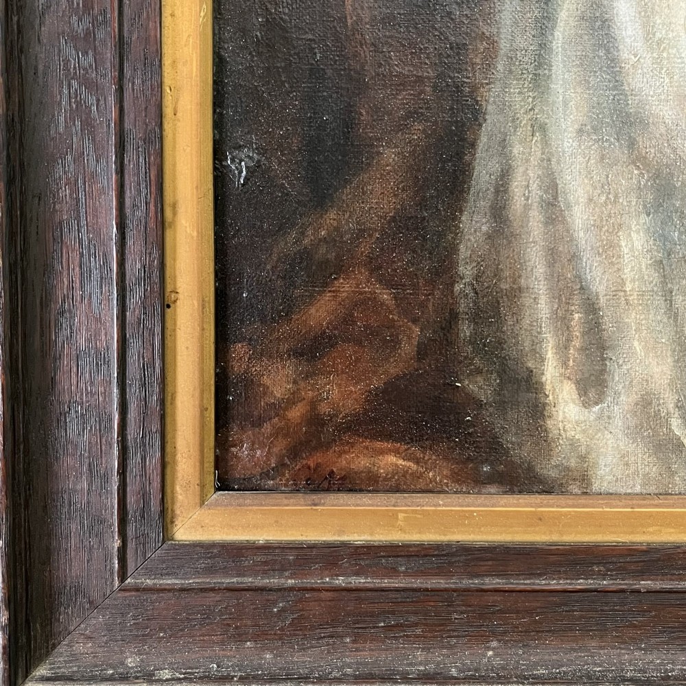 An Edwardian oil painting on canvas featuring a seated young girl in a cream lace-collared dress, housed in a dark wooden frame with a gold inner slip. View VII